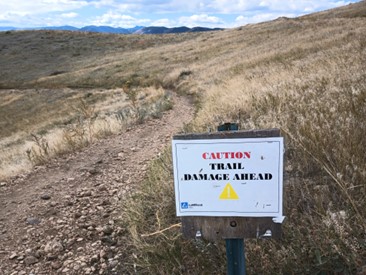 sign "trail damage ahead"