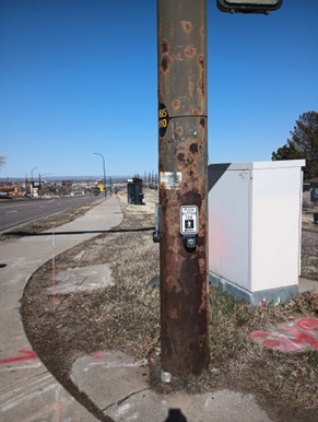 Unmaintained pole at crosswalk